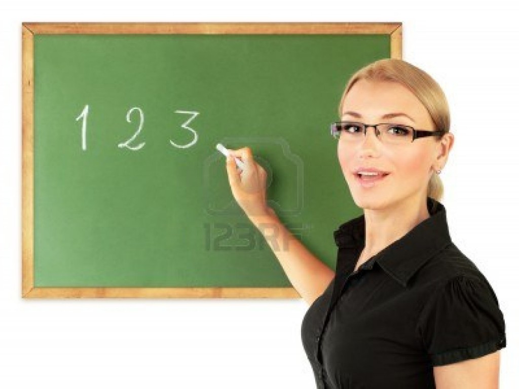 10082378-young-teacher-writing-numbers-on-the-chalkboard-isolated-on-white-background-conceptual-image-of-edu